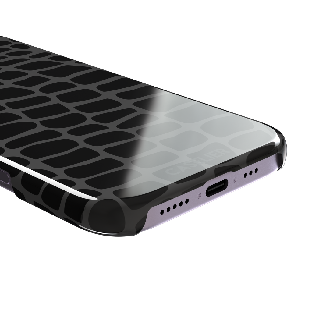 Crocodile phone case in black and dark grey croc-scale pattern, phone case by Caselier — snap case, charging port detail
