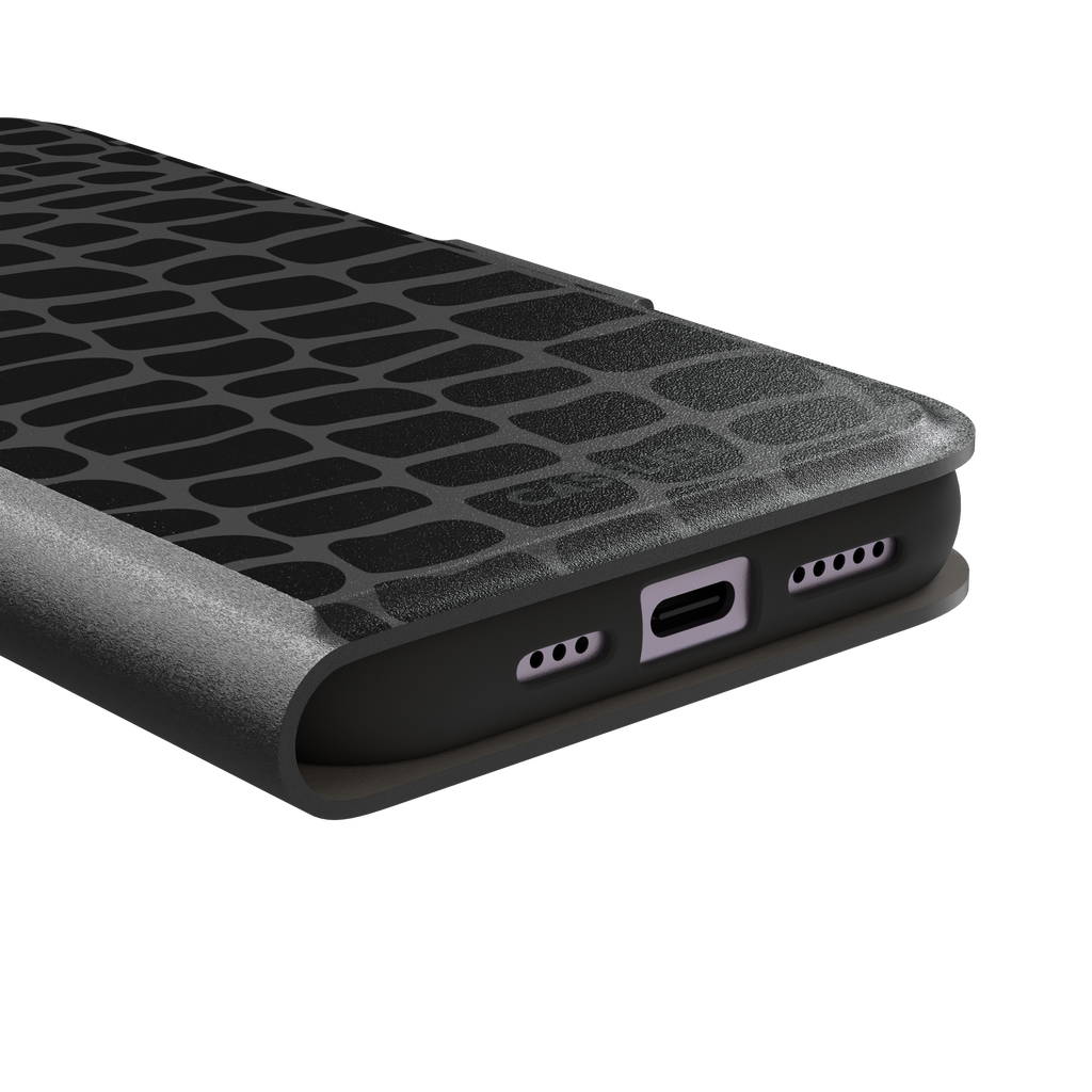 Crocodile phone case in black and dark grey croc-scale pattern, phone case by Caselier — wallet case, charging port detail