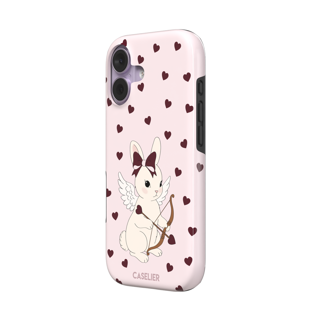 Blush pink phone case featuring a winged white cupid bunny with a burgundy bow and arrow surrounded by dark red hearts, phone case by Caselier — tough case, right view