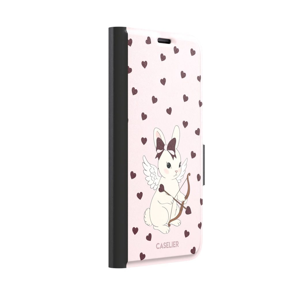 Blush pink phone case featuring a winged white cupid bunny with a burgundy bow and arrow surrounded by dark red hearts, phone case by Caselier — wallet case, left view