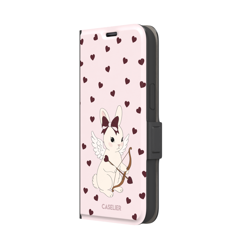 Blush pink phone case featuring a winged white cupid bunny with a burgundy bow and arrow surrounded by dark red hearts, phone case by Caselier — wallet case, right view
