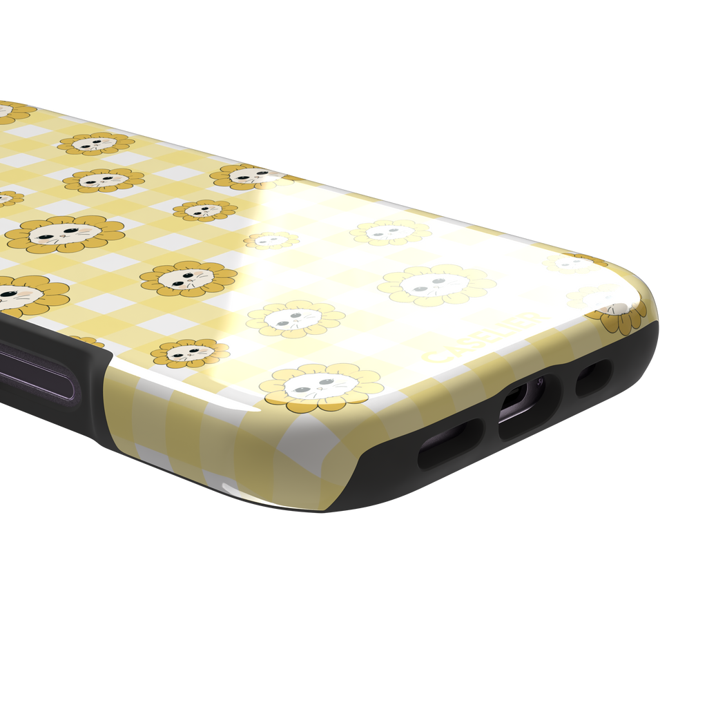 Daisies collection variant featuring cute cat-face flowers with golden petals scattered across a yellow and white gingham pattern, phone case by Caselier — tough case, charging port detail | Caselier