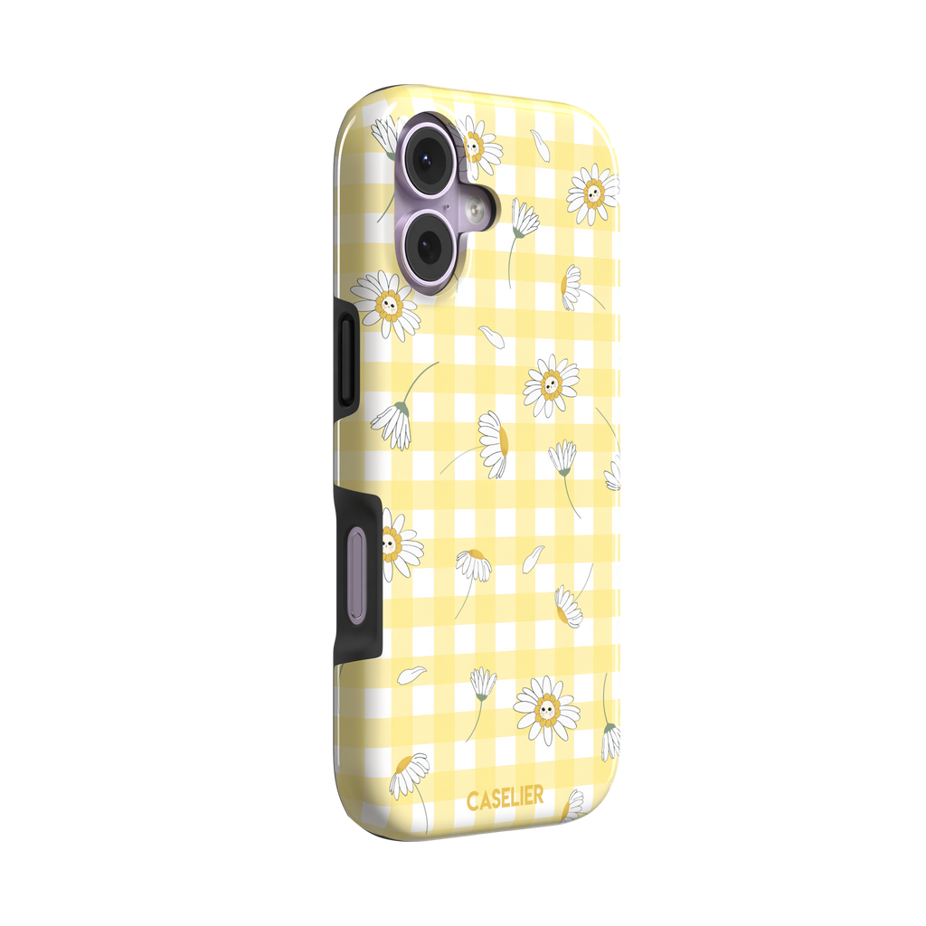 Daisies phone case variant showing white daisy flowers with small smiley faces at their centres on a yellow gingham background, phone case by Caselier — tough case, left view | Caselier
