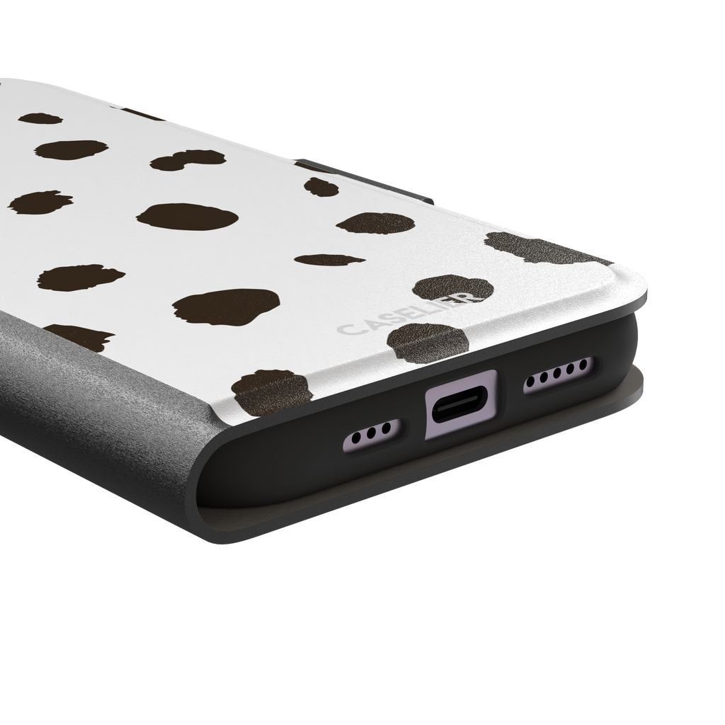 Dalmatian phone case variant with dark brown spots on a white background, phone case by Caselier — wallet case, charging port detail