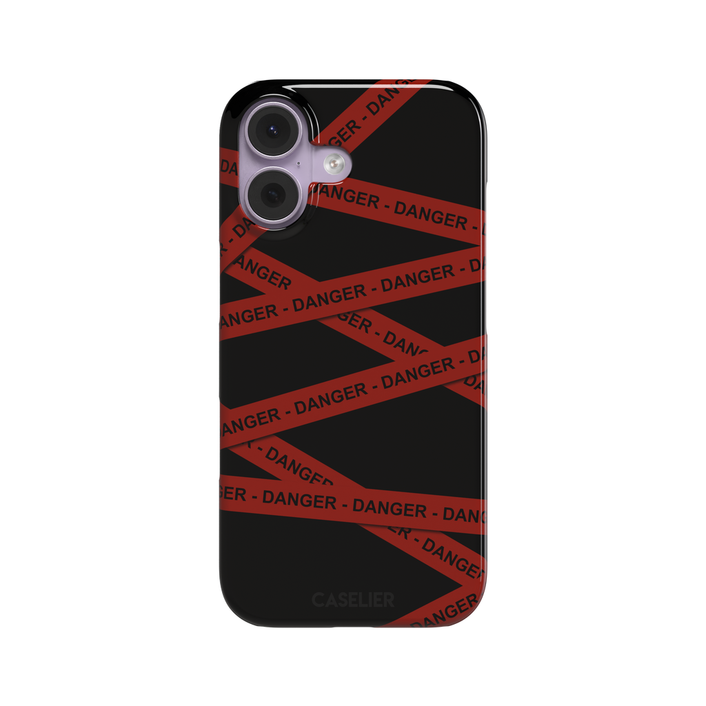 Black phone case with criss-crossing red danger tape strips printed diagonally across the back, featuring bold repeated DANGER text in black lettering — snap case, front view
