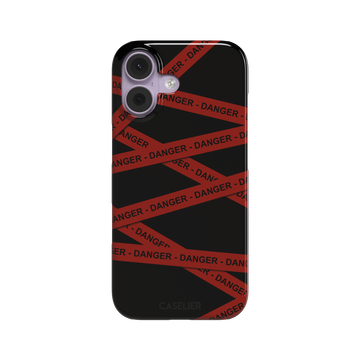 Black phone case with criss-crossing red danger tape strips printed diagonally across the back, featuring bold repeated DANGER text in black lettering — snap case, front view