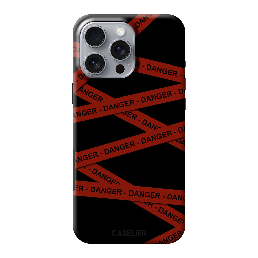 Phone case with red and black 'Danger' pattern on a black background