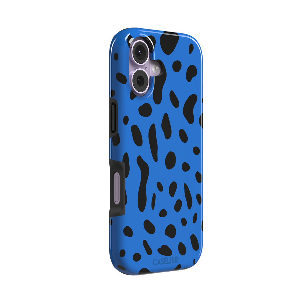 Frog phone case in cobalt blue with scattered irregular black spots in an animal print pattern, phone case by Caselier — tough case, left view