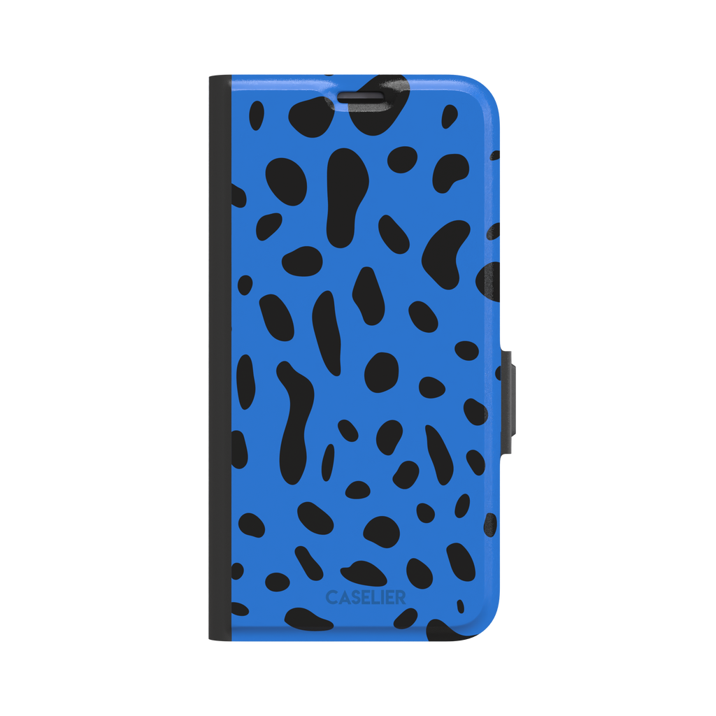 Frog phone case in cobalt blue with scattered irregular black spots in an animal print pattern, phone case by Caselier — wallet case, front view