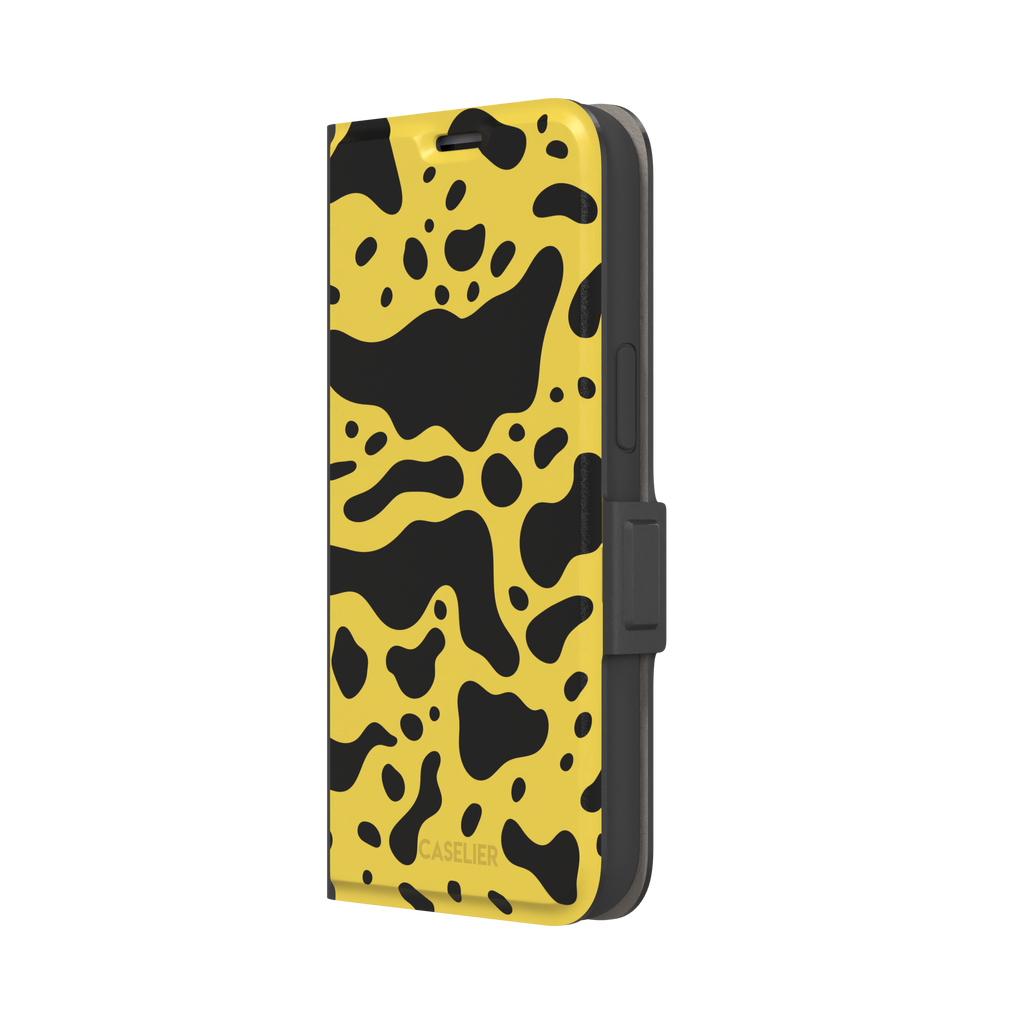 Frog phone case color variant in mustard yellow with large flowing black animal print patches, phone case by Caselier — wallet case, right view