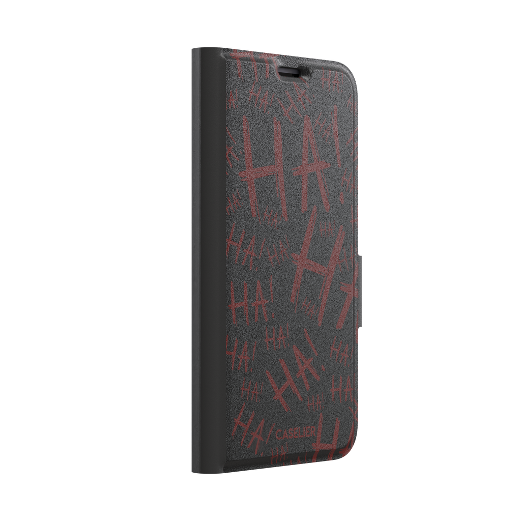 Black phone case covered in chaotic dark-red brushstroke HA! lettering in a horror villain style, phone case by Caselier — wallet case, left view