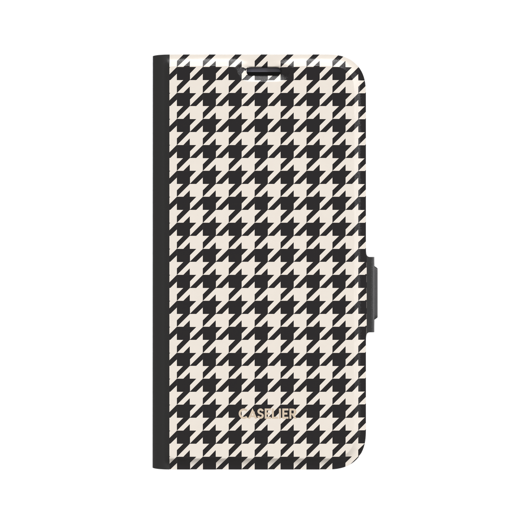 Front-facing view of a black-edged folio wallet case covered in black and cream houndstooth pattern, white background, phone case by Caselier - wallet case, front view | Caselier