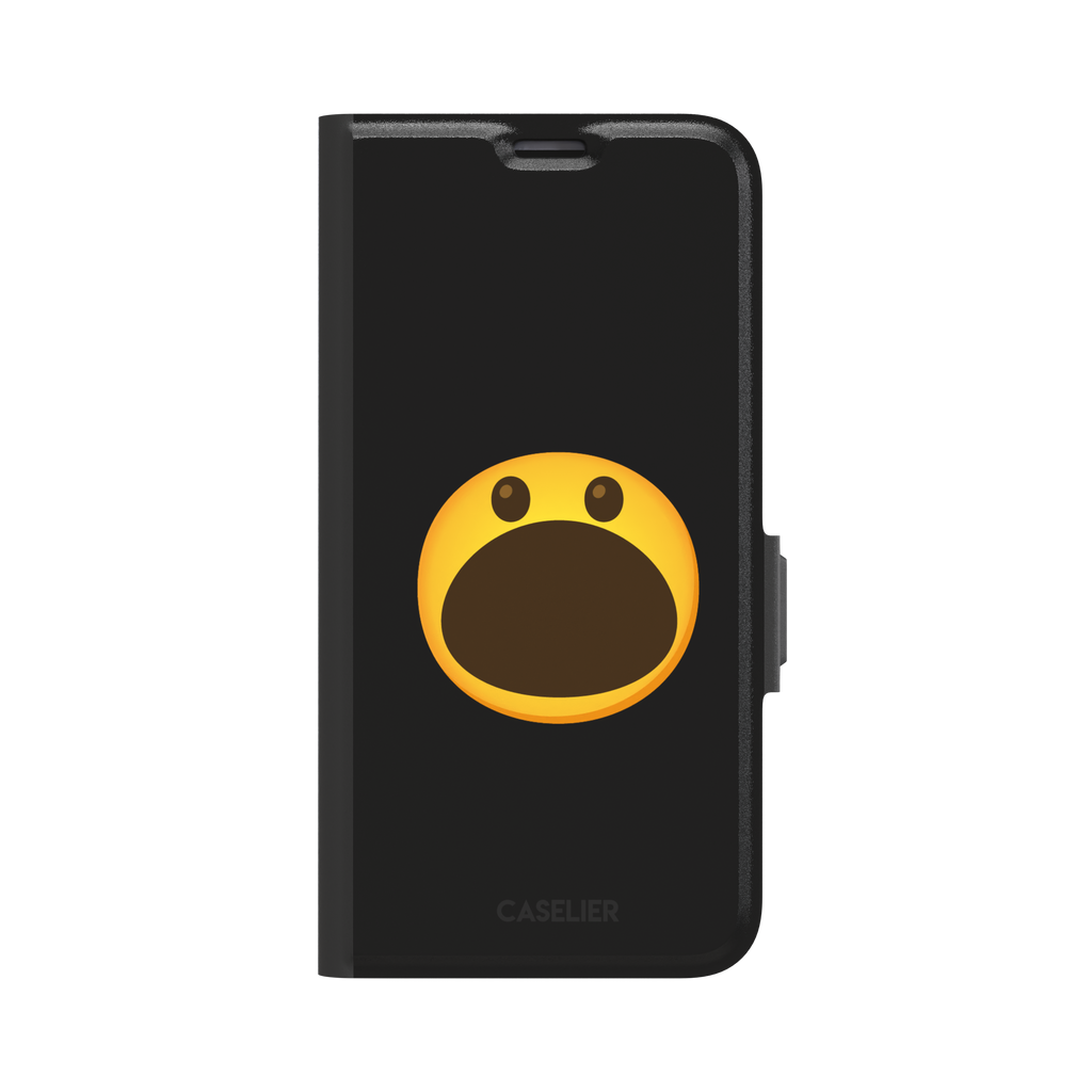 Hungry phone case featuring a bold yellow wide-mouthed screaming emoji on a matte black background, phone case by Caselier — wallet case, front view