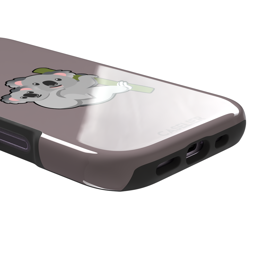 Mauve phone case with a kawaii illustration of a mama koala and baby joey clinging to a green eucalyptus branch, phone case by Caselier — tough case, charging port detail