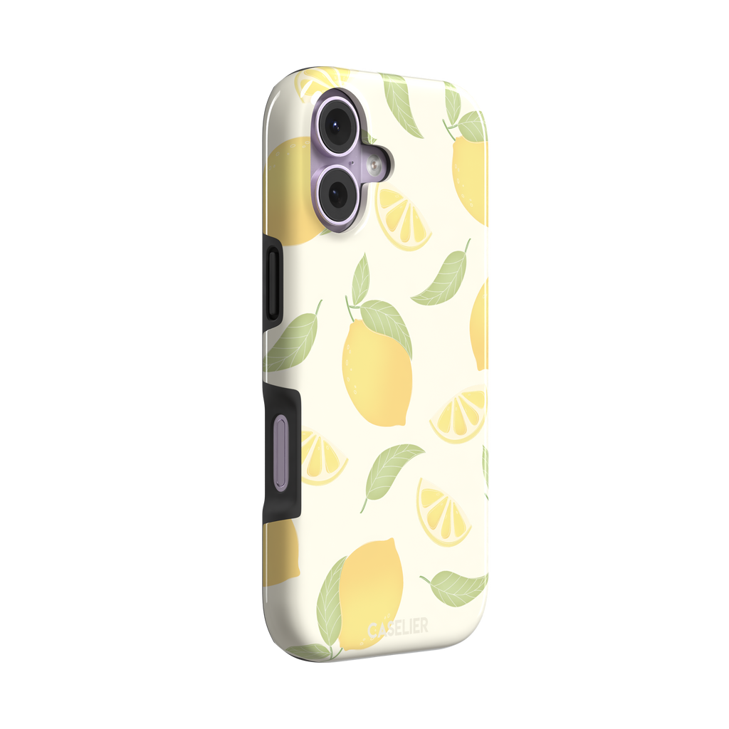 Lemons phone case with a cream background featuring golden whole lemons, lemon slices, and sage green leaves in a repeat pattern, phone case by Caselier — tough case, left view