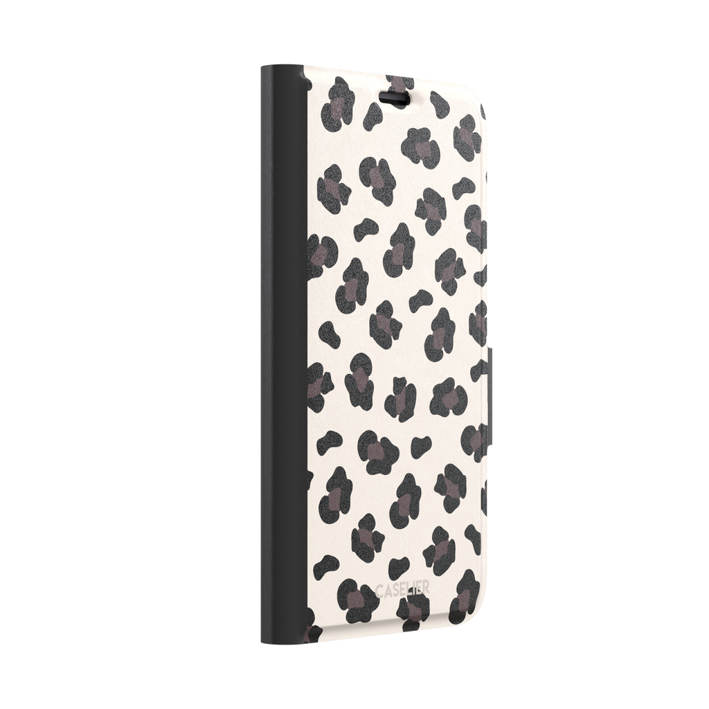 Leopard print phone case in black and dark brown spots on warm cream background, color variant, phone case by Caselier — wallet case, left view