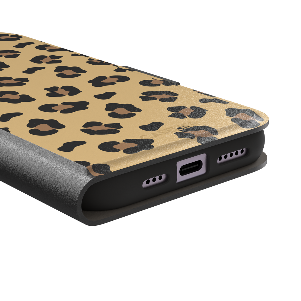 Leopard print phone case in black and brown spots on sandy golden-yellow background, color variant, phone case by Caselier — wallet case, charging port detail