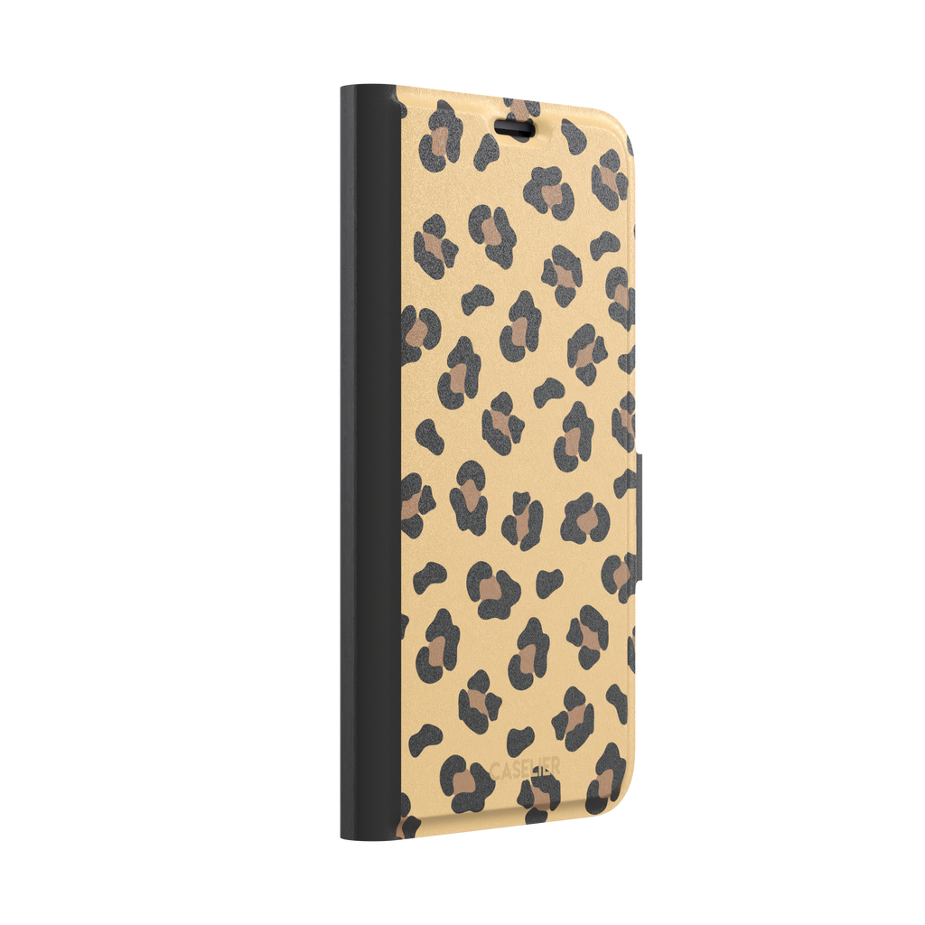 Leopard print phone case in black and brown spots on sandy golden-yellow background, color variant, phone case by Caselier — wallet case, left view