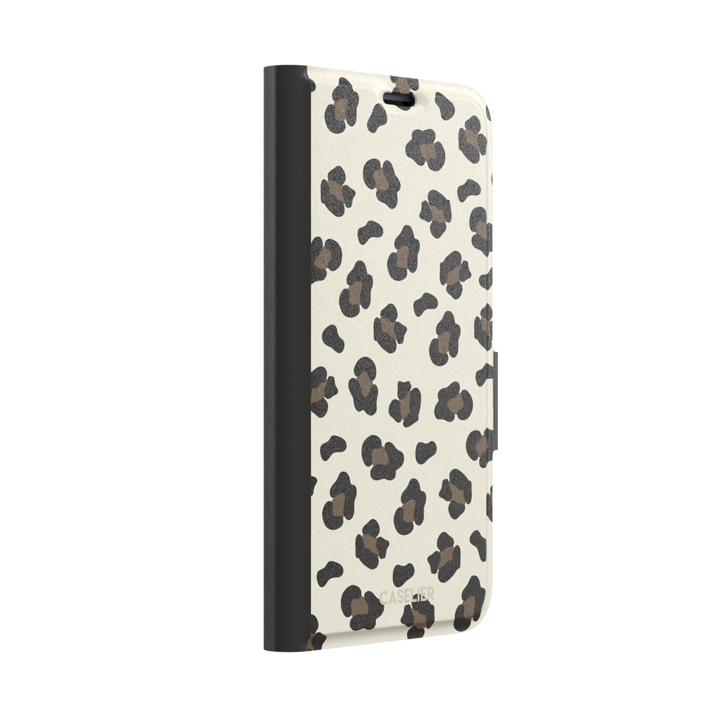 Leopard print phone case in black and medium brown spots on light beige background, color variant, phone case by Caselier — wallet case, left view