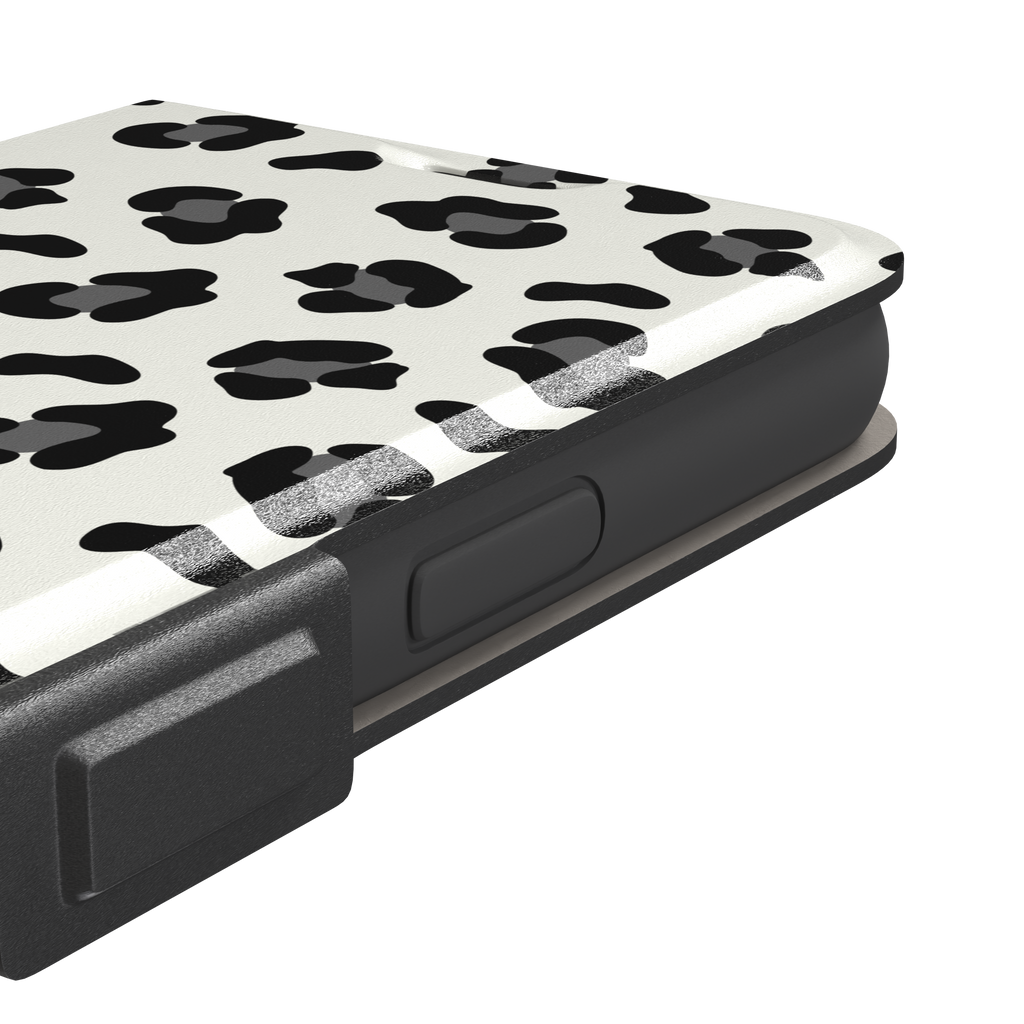 Leopard print phone case in black spots on off-white background, primary product shot, phone case by Caselier — wallet case, volume buttons detail