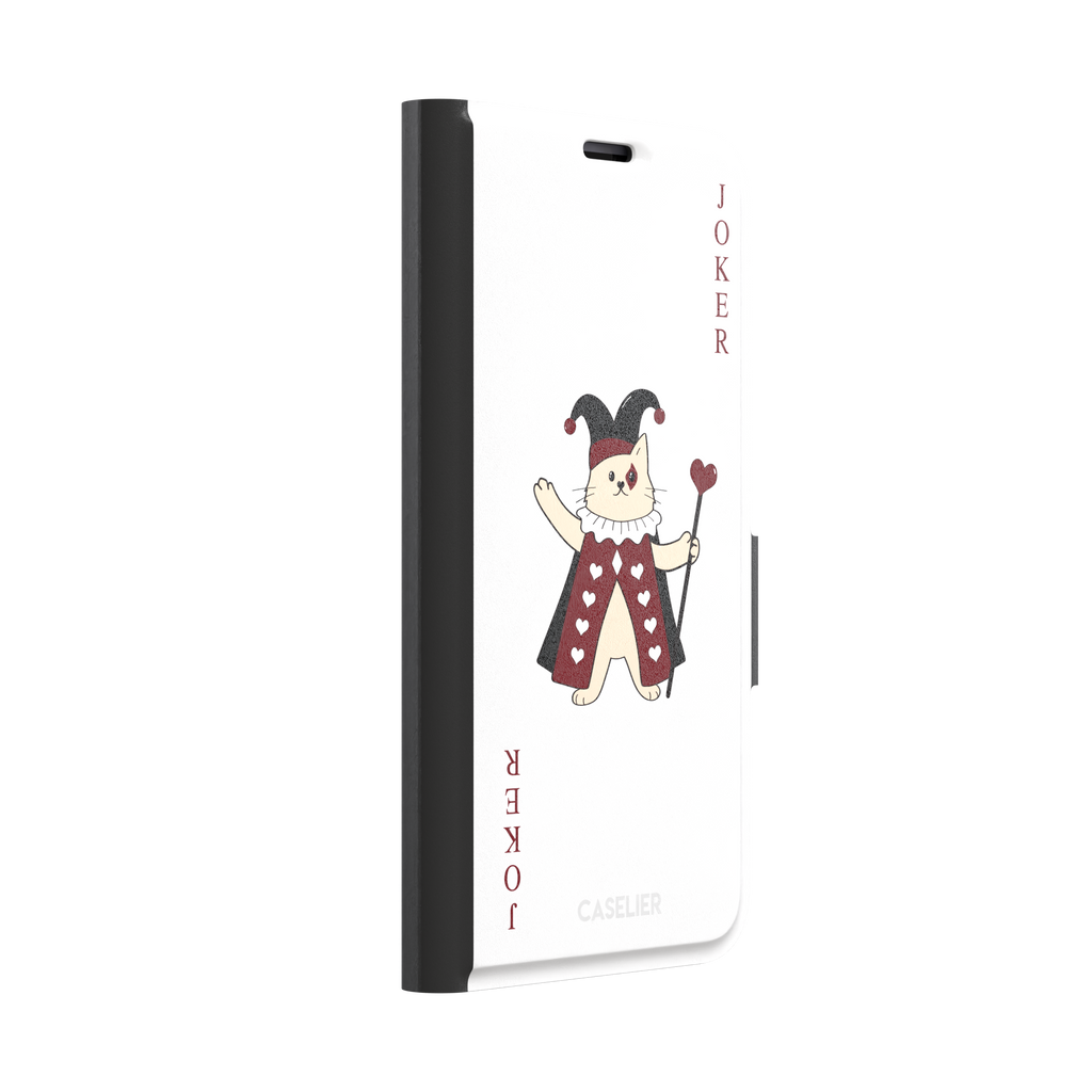 Lord of Jokers phone case in white featuring the same illustrated cat joker in a crimson heart-patterned robe and black jester hat, holding a heart staff, styled as a playing card with JOKER lettered vertically in dark red, white background color variant, phone case by Caselier — wallet case, left view