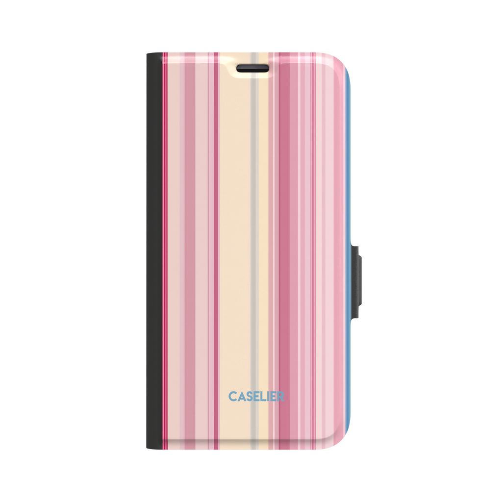 Folio wallet phone case with vertical stripes in deep rose, soft pink, cream and periwinkle blue, front-facing view with black spine and blue side trim, phone case by Caselier - wallet case, front view | Caselier