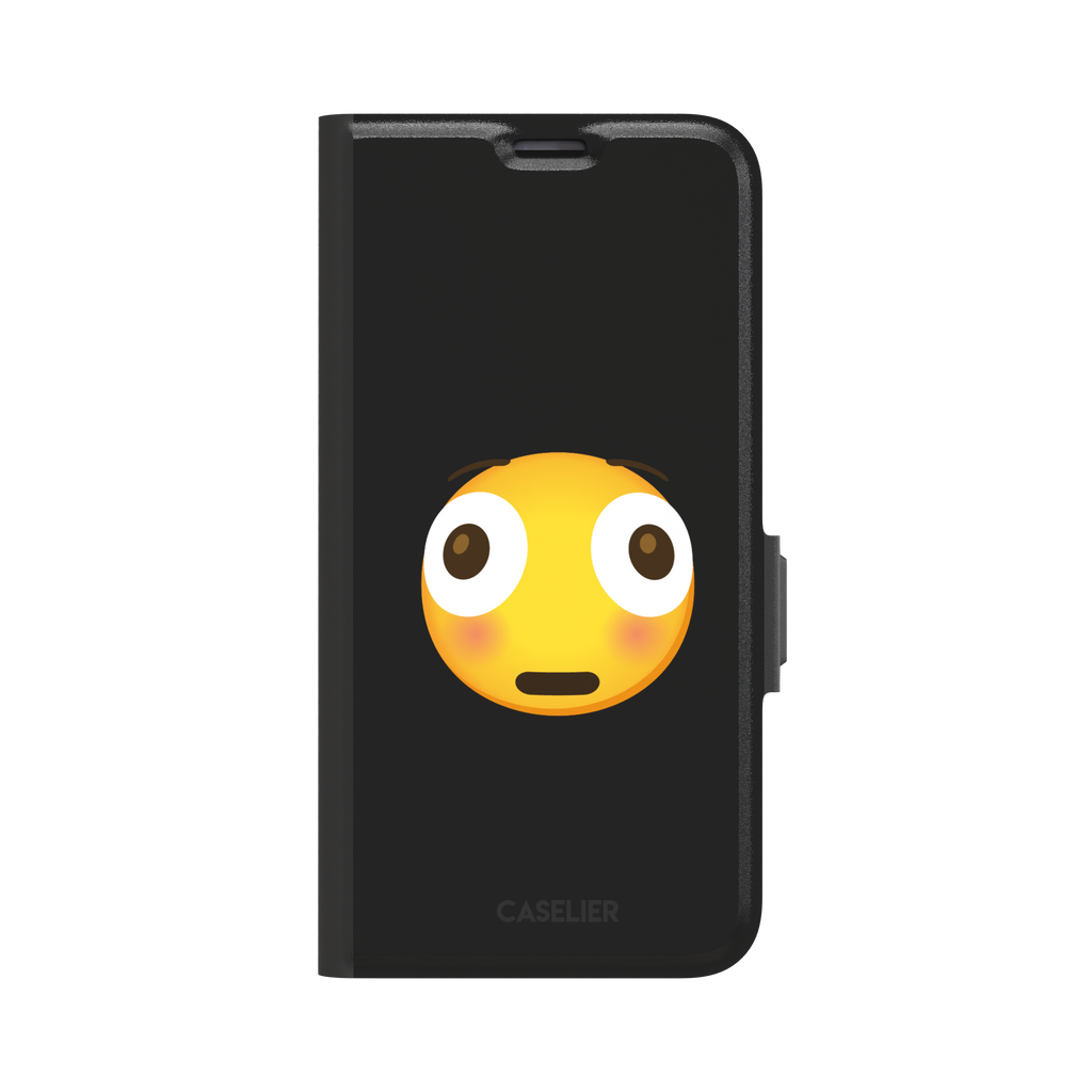 Moments Before Disaster phone case featuring a large flushed emoji face with wide eyes and rosy cheeks on a matte black background, phone case by Caselier — wallet case, front view
