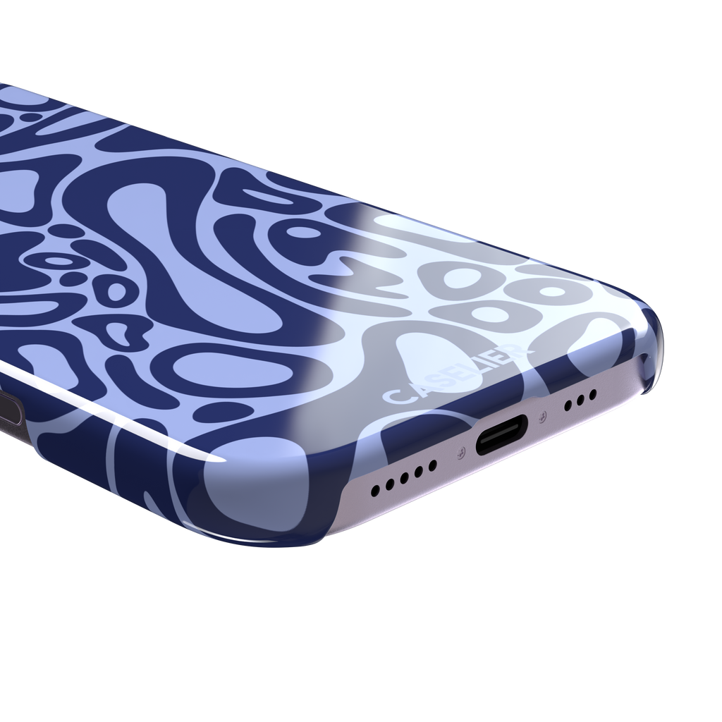 Norris Pattern phone case in periwinkle blue and navy with fluid swirling abstract shapes covering the full back, phone case by Caselier — snap case, charging port detail