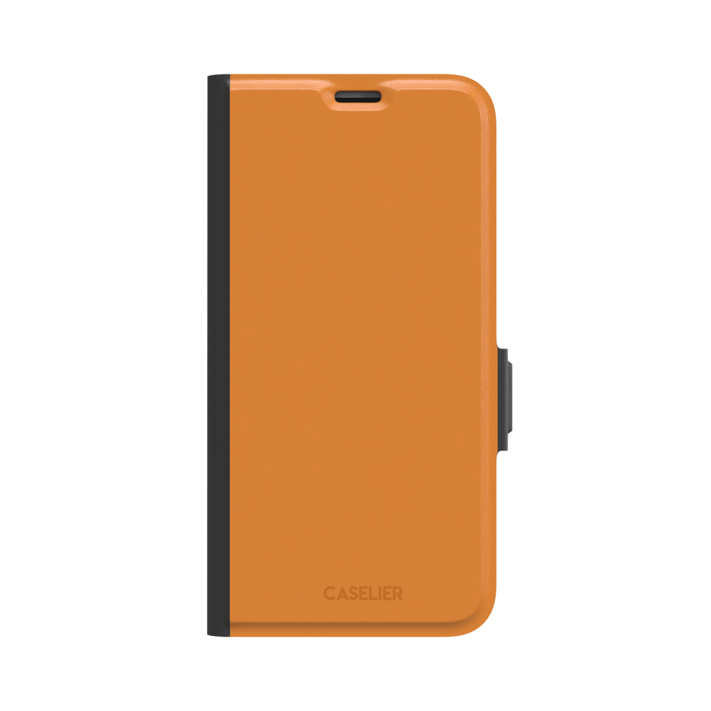 Deep golden-tan solid-color phone case variant on iPhone, phone case by Caselier — wallet case, front view