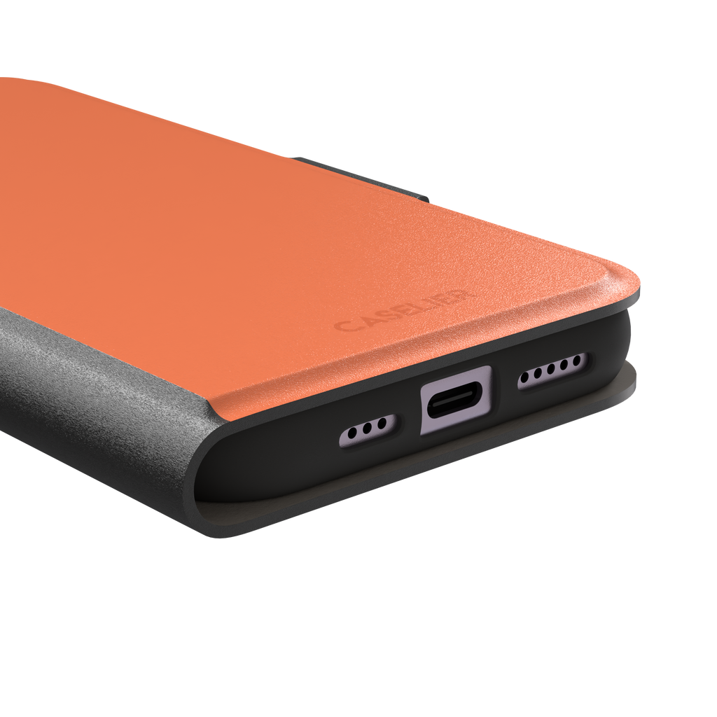 Light coral-orange solid-color phone case variant on iPhone, phone case by Caselier — wallet case, charging port detail