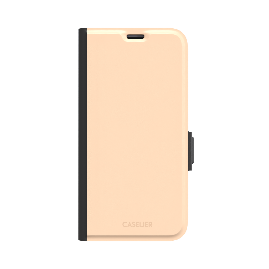 Soft peach solid-color phone case variant with warm pastel finish on iPhone, phone case by Caselier — wallet case, front view