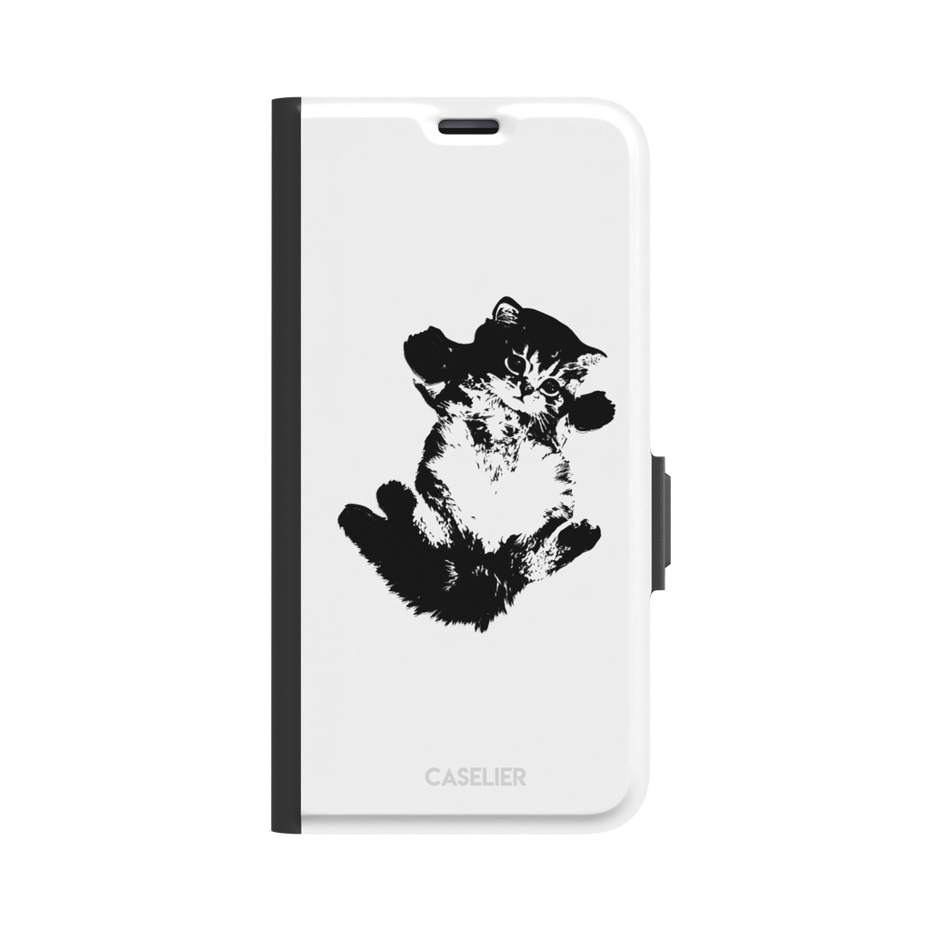 White phone case with a bold black-and-white ink-style illustration of a fluffy kitten lying on its back with paws raised, phone case by Caselier — wallet case, front view