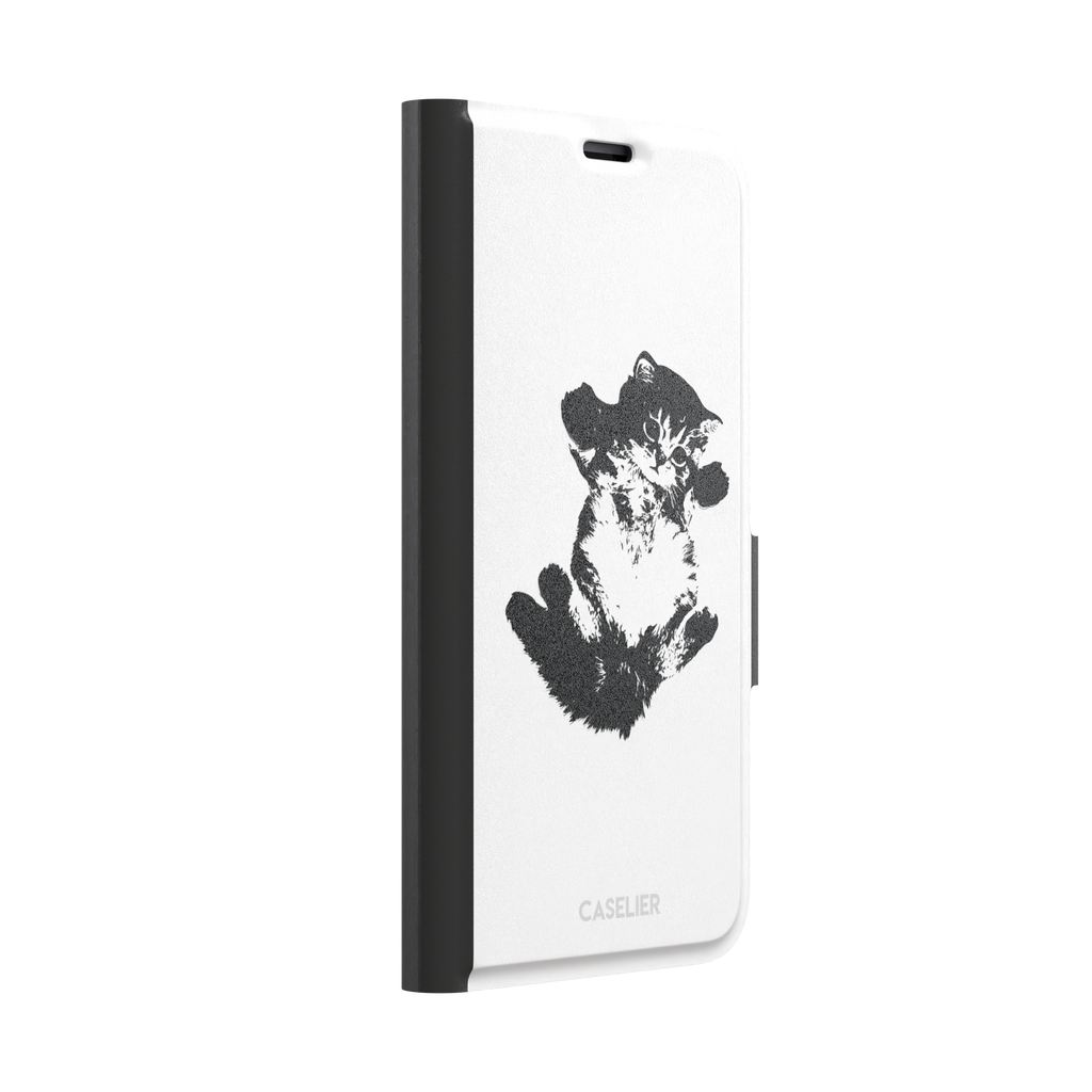 White phone case with a bold black-and-white ink-style illustration of a fluffy kitten lying on its back with paws raised, phone case by Caselier — wallet case, left view