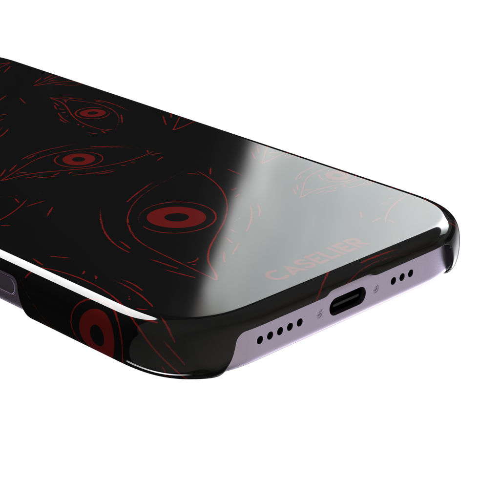 Paranoia phone case in black with all-over deep red hand-drawn staring eyes and sharp angular lashes, color variant, phone case by Caselier — snap case, charging port detail