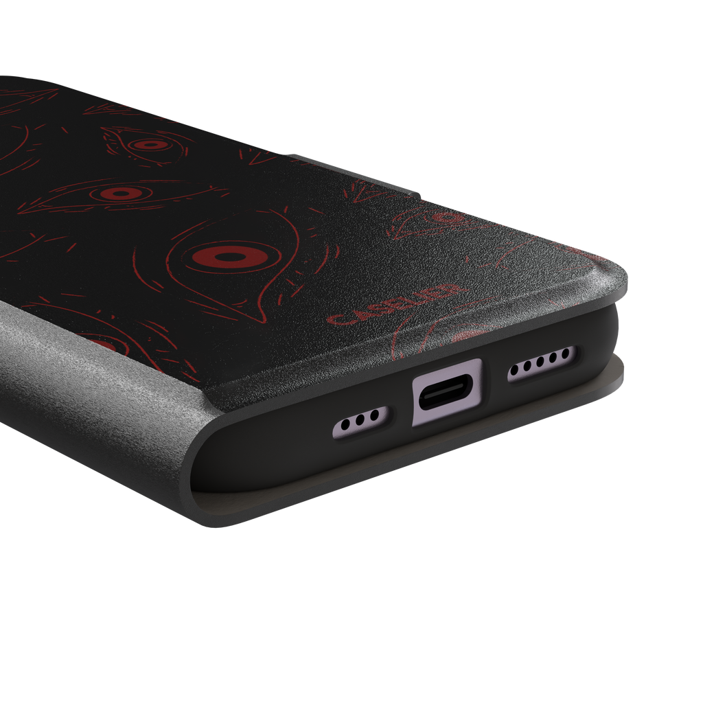 Paranoia phone case in black with all-over deep red hand-drawn staring eyes and sharp angular lashes, color variant, phone case by Caselier — wallet case, charging port detail
