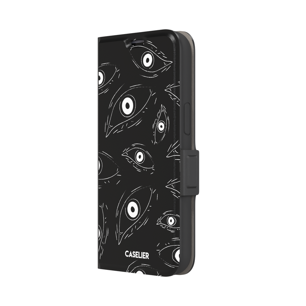 Paranoia phone case in black with all-over white hand-drawn staring eyes and sharp angular lashes, phone case by Caselier — wallet case, right view