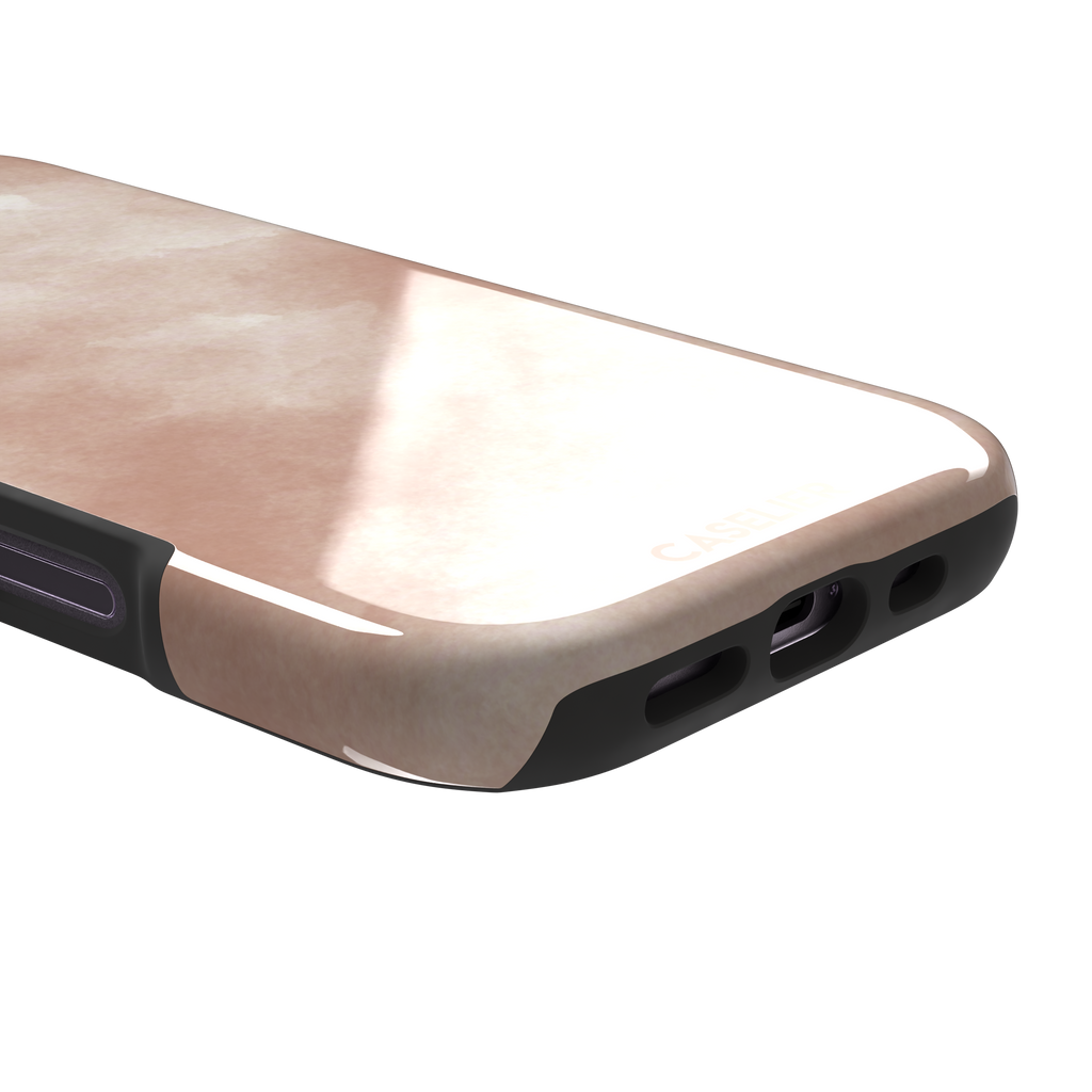 Peach watercolor wash phone case in warm blush and cream tones on an iPhone, phone case by Caselier — tough case, charging port detail