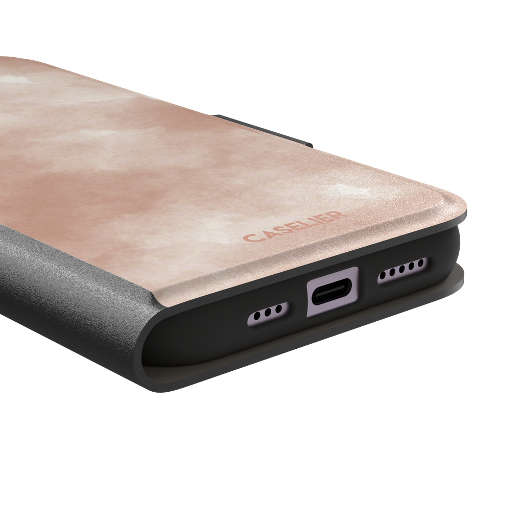 Peach watercolor wash phone case in warm blush and cream tones on an iPhone, phone case by Caselier — wallet case, charging port detail