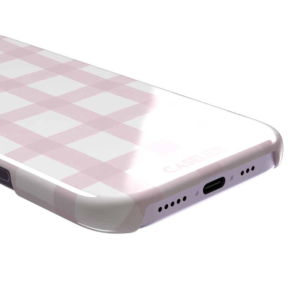 Pink Grid phone case featuring a soft blush pink gingham check pattern with hand-painted brushstroke edges on a white background, by Caselier — snap case, charging port detail