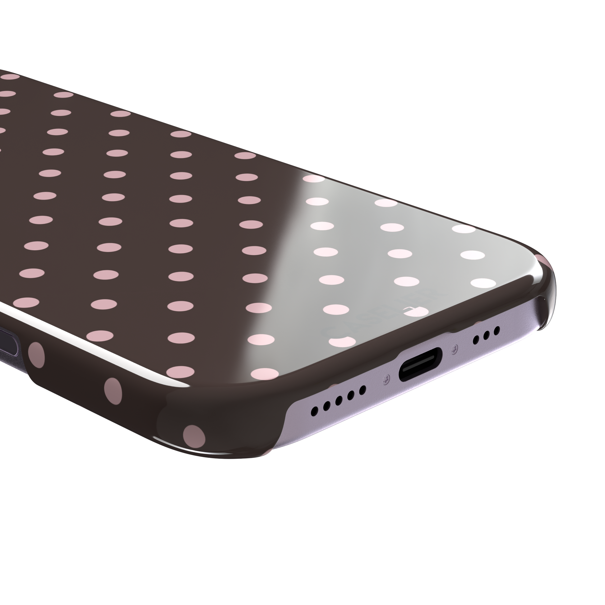 Polka dot phone case in deep brown with soft pink spots in an even all-over grid pattern, phone case by Caselier — snap case, charging port detail