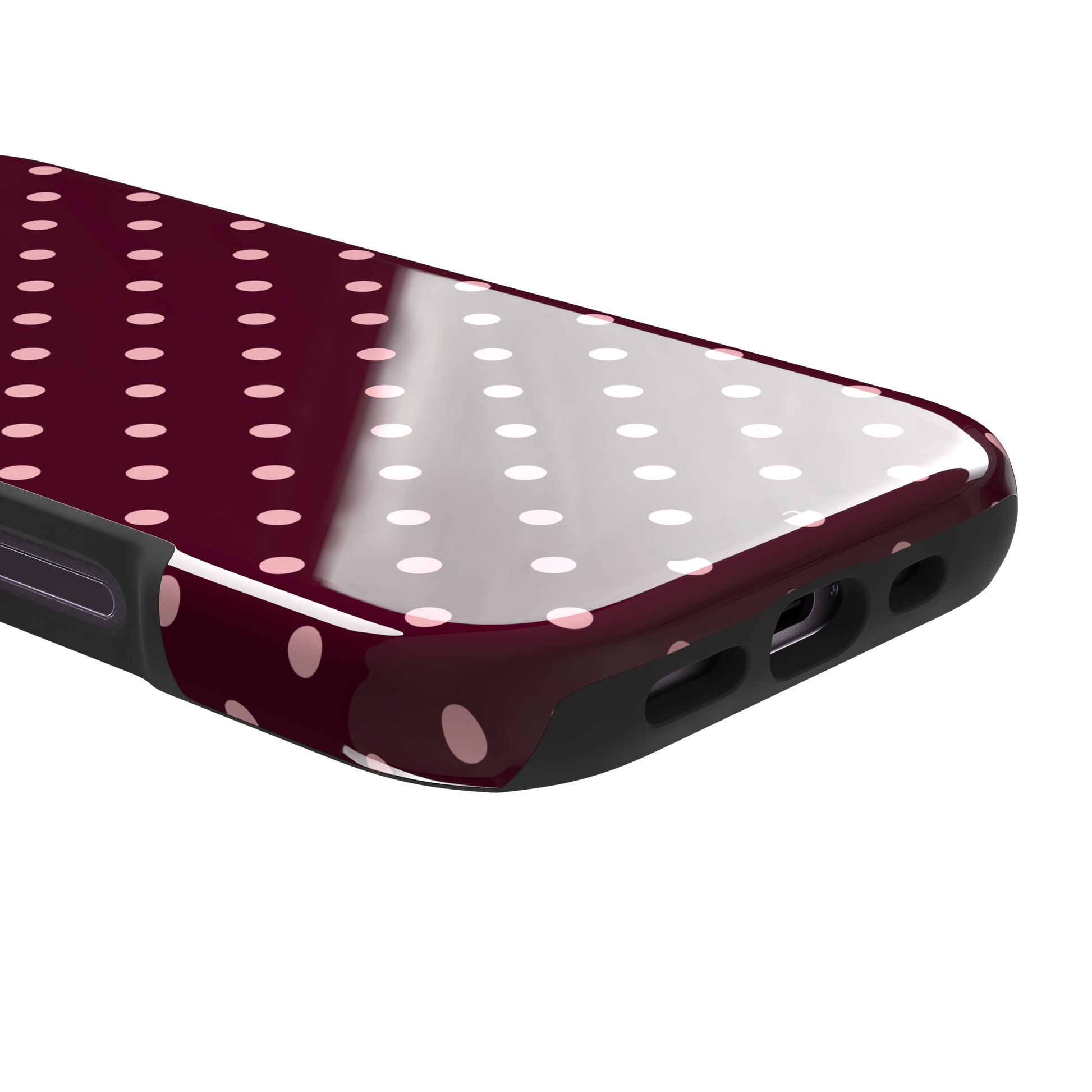 Polka dot phone case in deep burgundy with blush pink spots arranged in a classic evenly spaced grid, phone case by Caselier — tough case, charging port detail