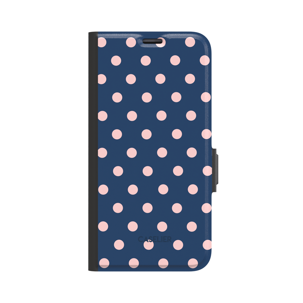 Polka dot phone case with deep navy blue background and soft blush pink dots in a classic two-tone pattern, phone case by Caselier - wallet case, front view | Caselier