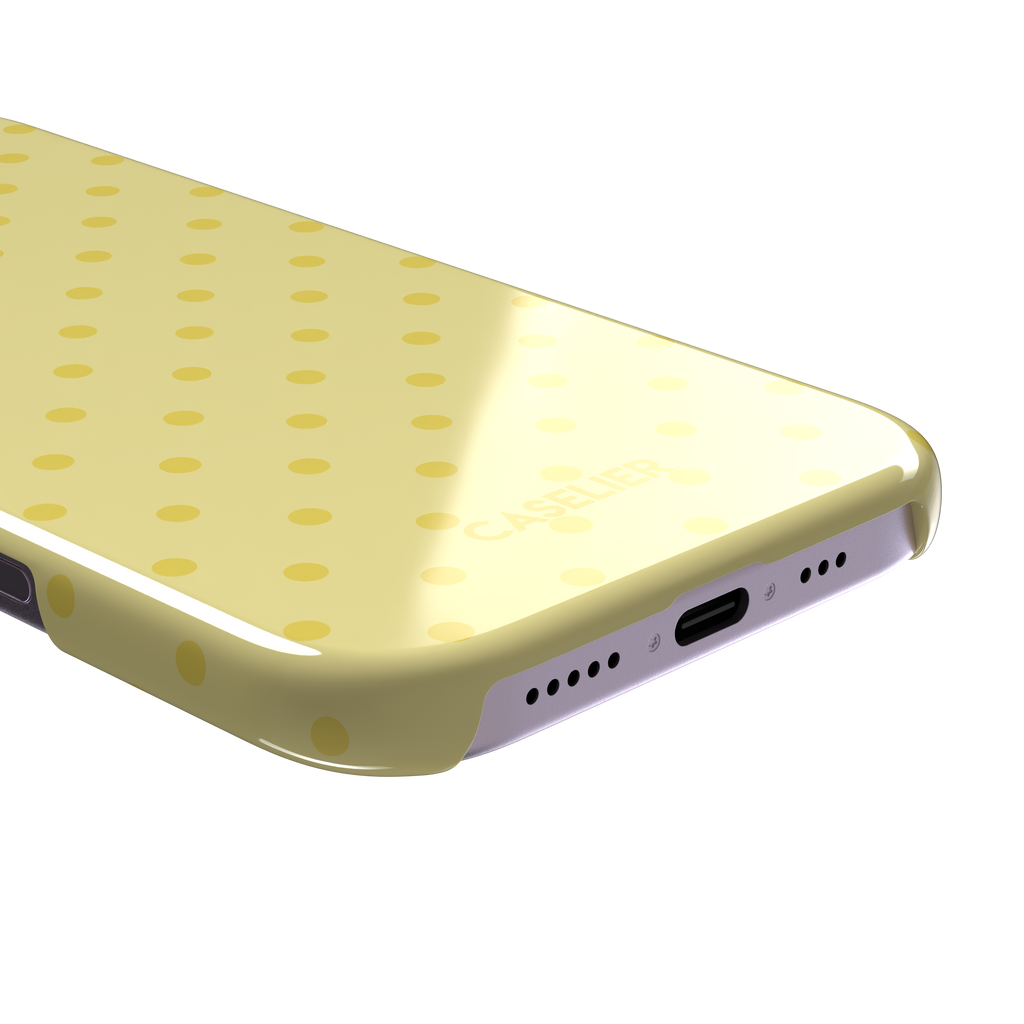 Polka Freckles, yellow polka dots on a soft buttery yellow background, snap case, charging port detail, phone case by Caselier
