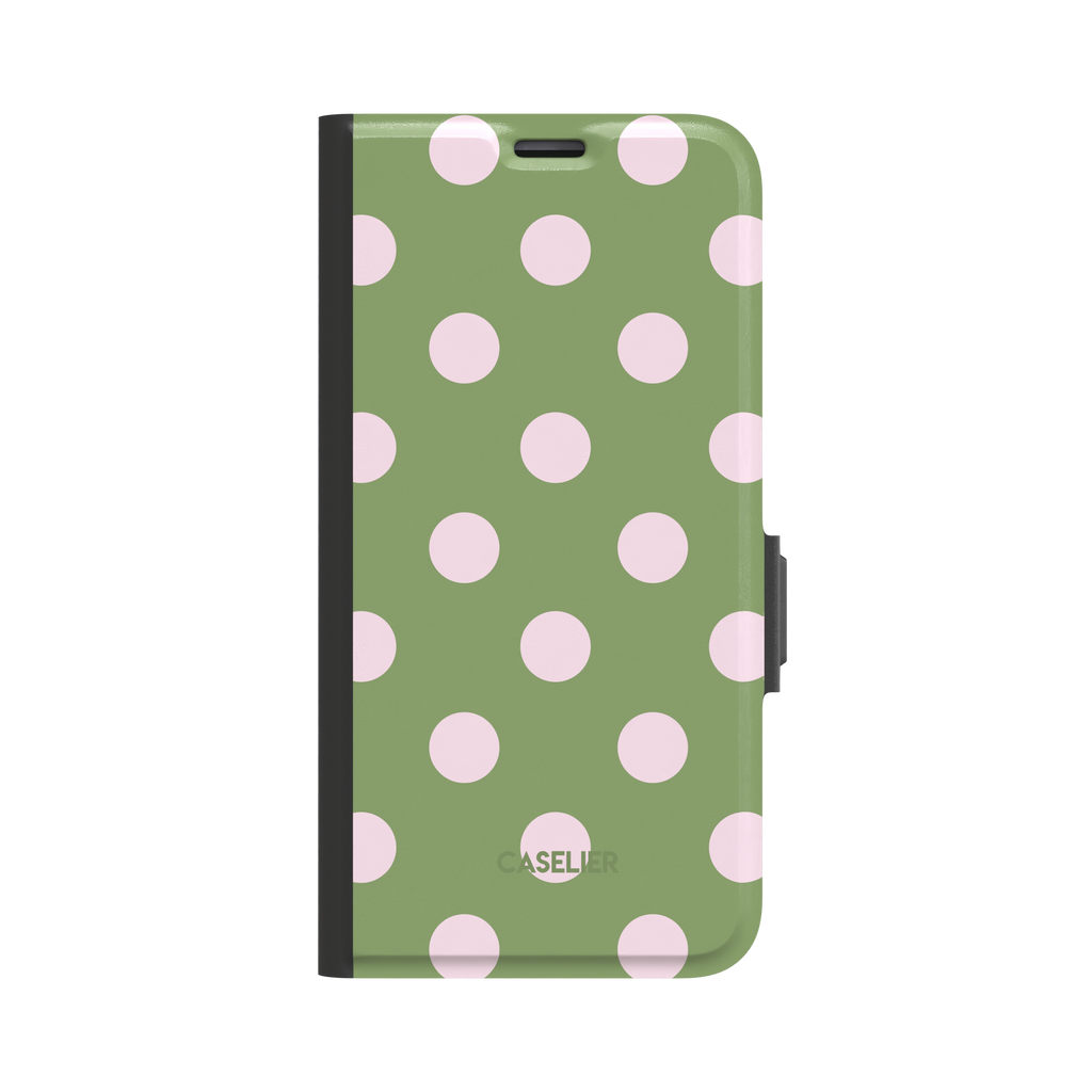 Polka Spots folio wallet case in sage green with soft pink polka dots, black spine and clasp, front-facing product shot on white background, phone case by Caselier - wallet case, front view | Caselier