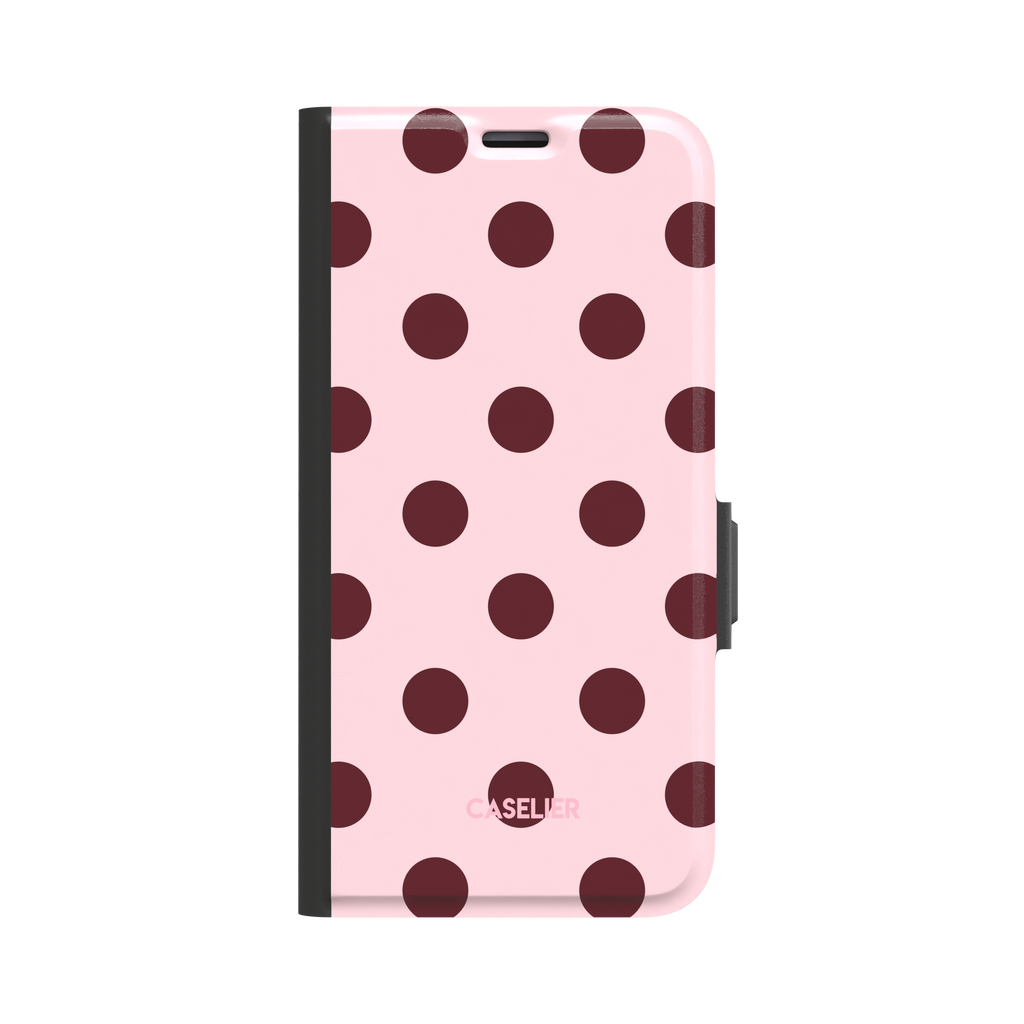 Polka Spots folio wallet case in blush pink with deep burgundy polka dots, black spine and clasp, front-facing product shot on white background, phone case by Caselier - wallet case, front view | Caselier