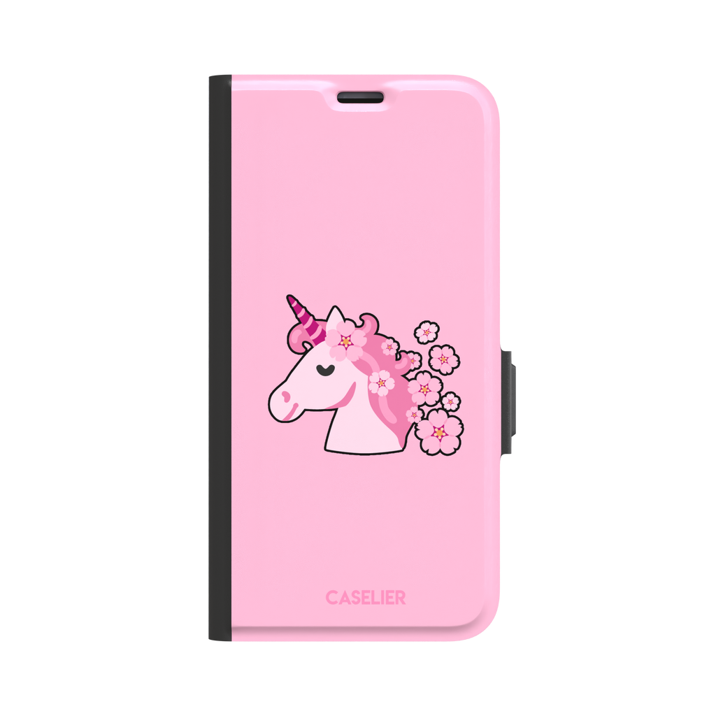 Pink phone case featuring a cute cartoon unicorn with a striped horn and a cherry blossom-filled mane on a bubblegum pink background, phone case by Caselier — wallet case, front view