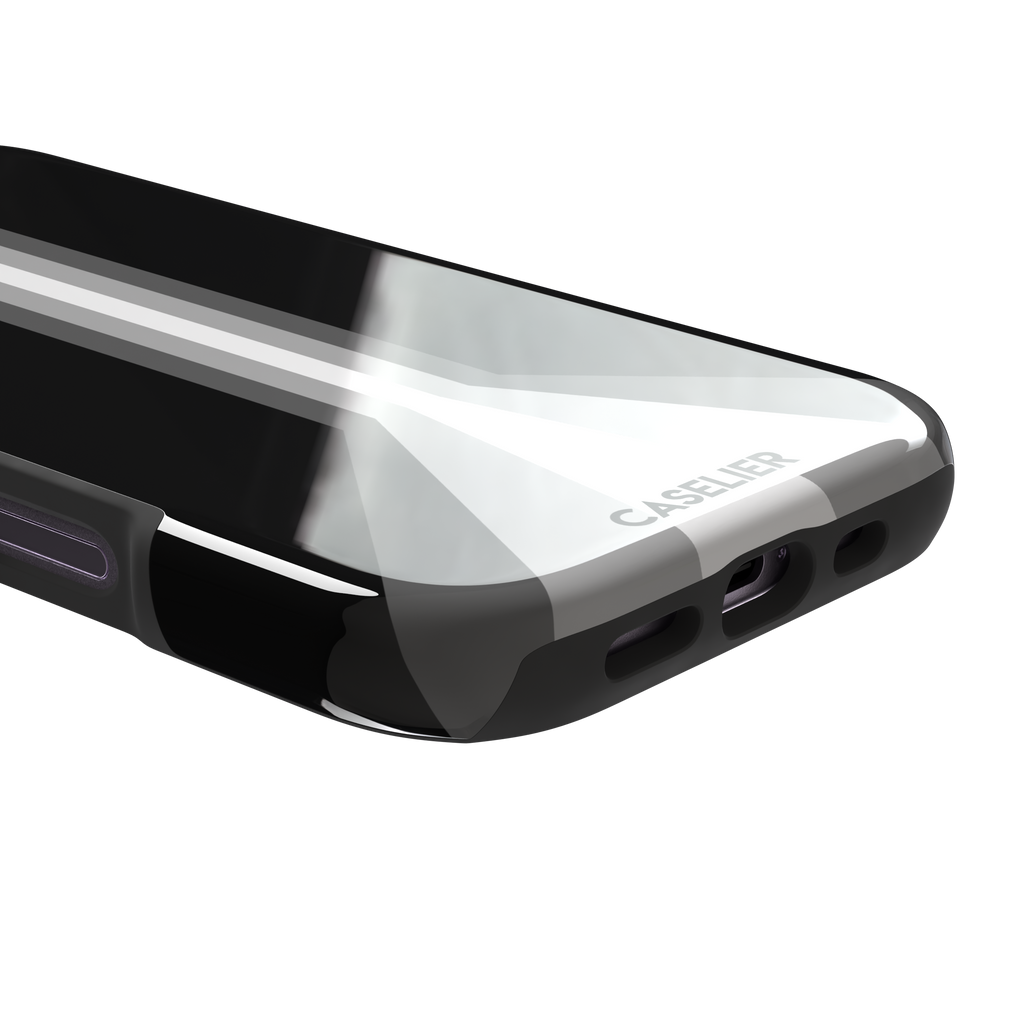 Prism phone case in black with white and grey geometric racing stripes fanning outward from a central vertical line, phone case by Caselier — tough case, charging port detail
