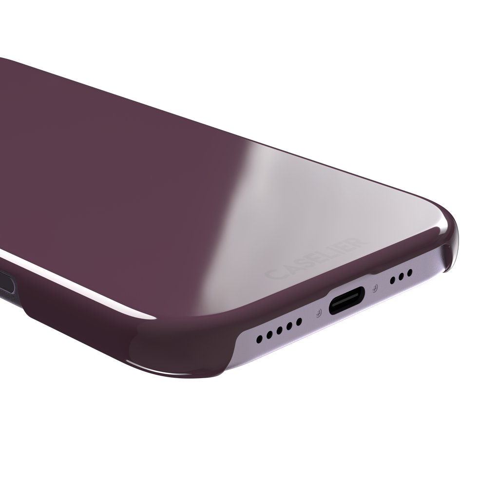 Solid burgundy-purple phone case in a muted, wine-toned purple, phone case by Caselier — snap case, charging port detail