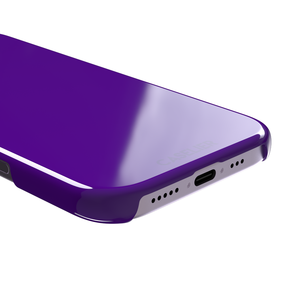 Solid electric violet phone case in a bold, cool deep purple tone, phone case by Caselier — snap case, charging port detail
