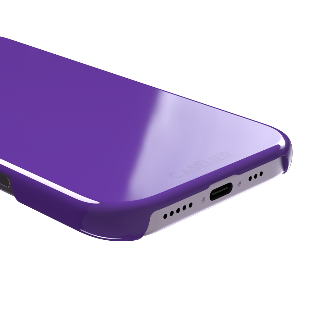 Solid bright violet phone case in a vivid, saturated purple tone, phone case by Caselier — snap case, charging port detail